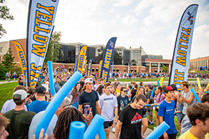 Students walk around the lake.