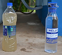 Bottles of dirty and clean water.
