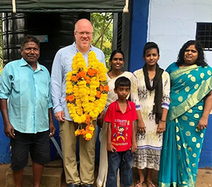 Dr. Pete Sevard with a family who now has clean water in Kadali, India.in