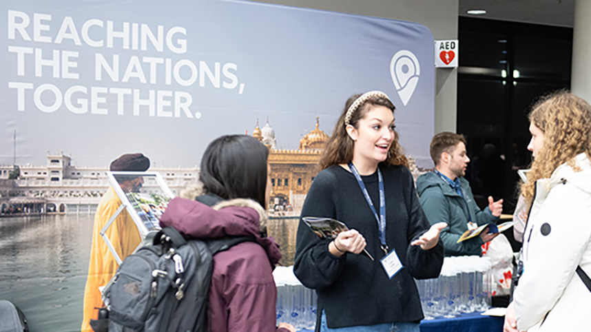 Students speaking with missions organization at GO Conference.