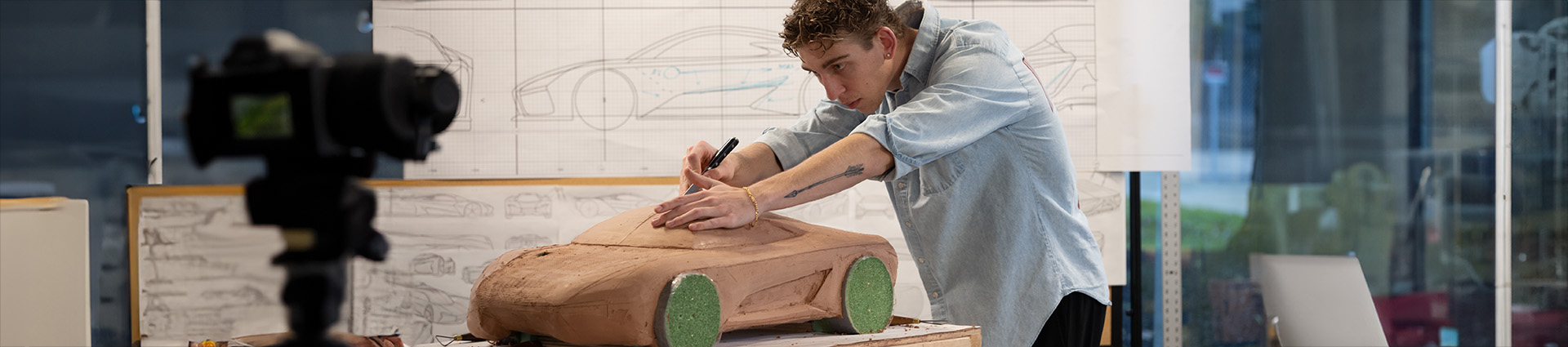 Student carves model of muscle car at the ICC.