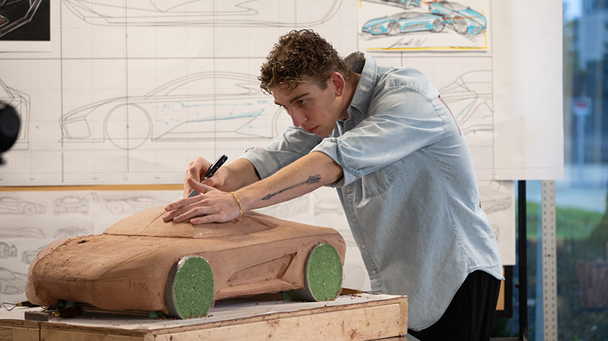 Student carves model of muscle car at the ICC.