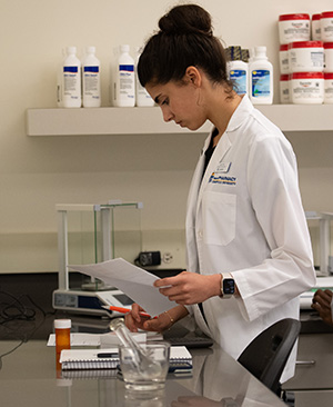 PharmD student at Cedarville University engaged in innovative research.