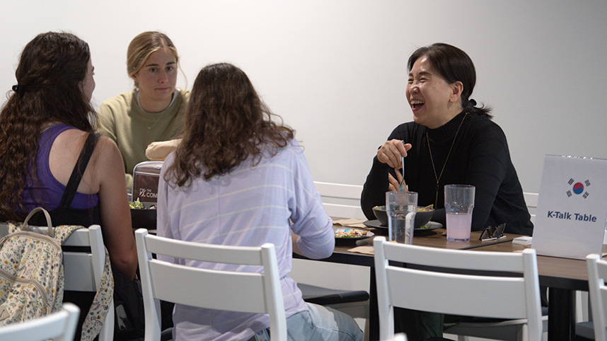 Dr. Kim teaches Korean over lunch in the Commons.