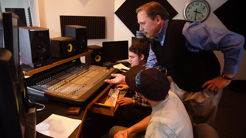 Jim Leightenheimer with students radio booth.