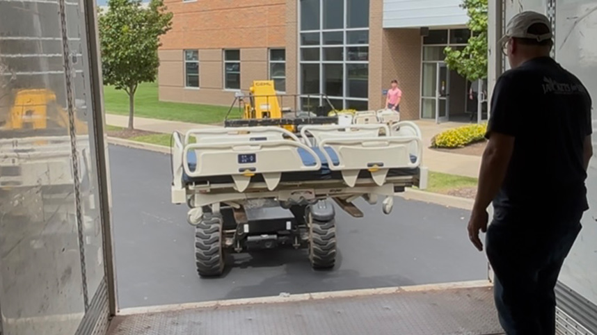 Loading donated hospital beds for transport to Advocates for World Health in Florida.