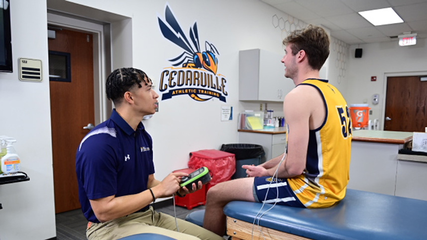 Cedarville University MAT student provides care for men's basketball player.