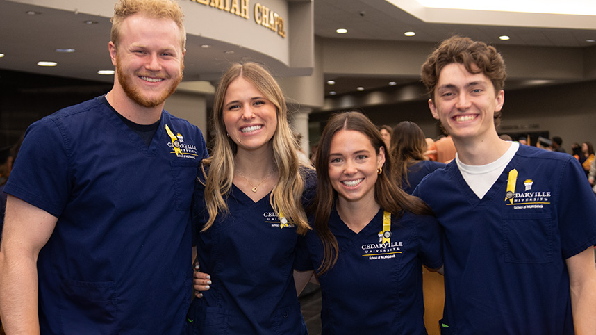 Smiling School of Nursing graduates.