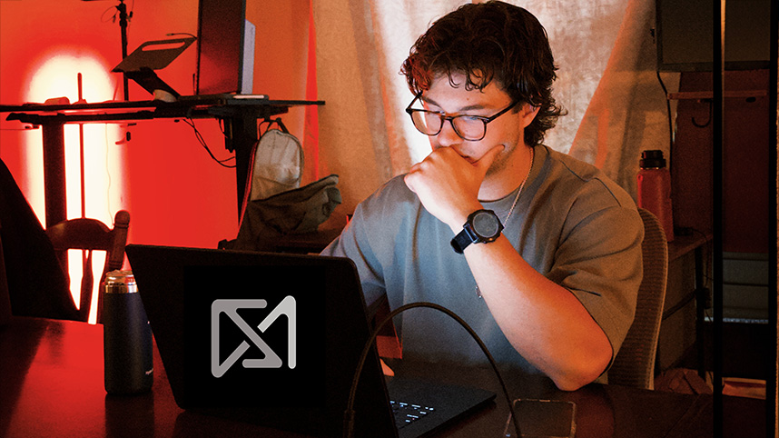 Aaron Perry working at computer.