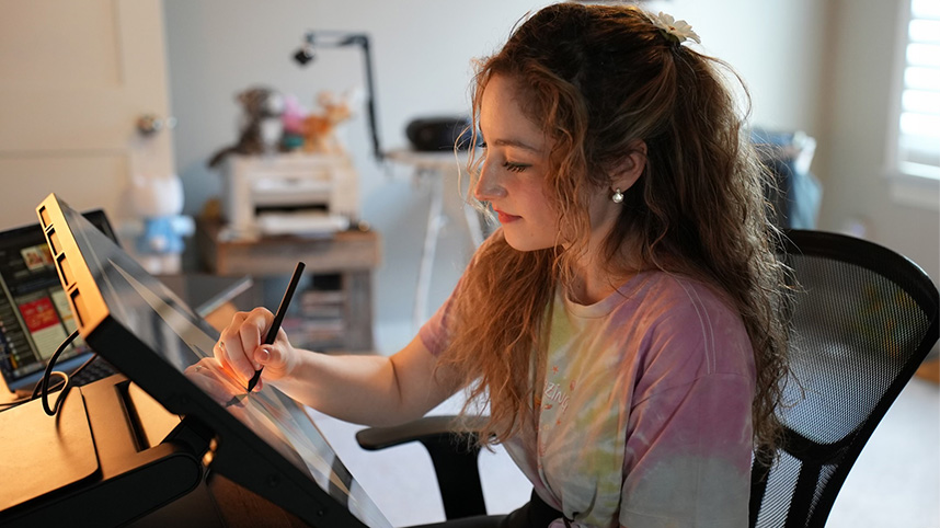 Aria Joy Prichard works on a digital illustration.