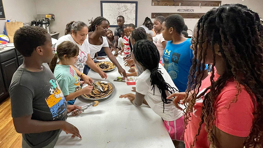 Serving snacks at international families night.