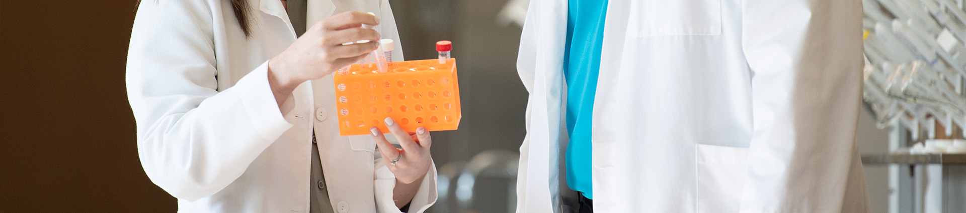 Pharmacist holding a test tube.