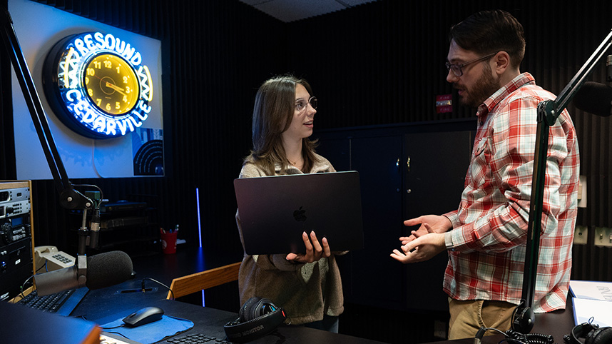 Craig Vinson works with a student at Resound Radio.