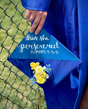 Ellie Wyse makes statement of faith with graduation cap.