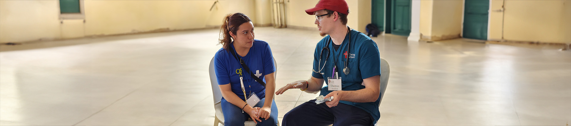 Thomas Bonifield shares pharmaceutical information with a female patient in Guatemala.