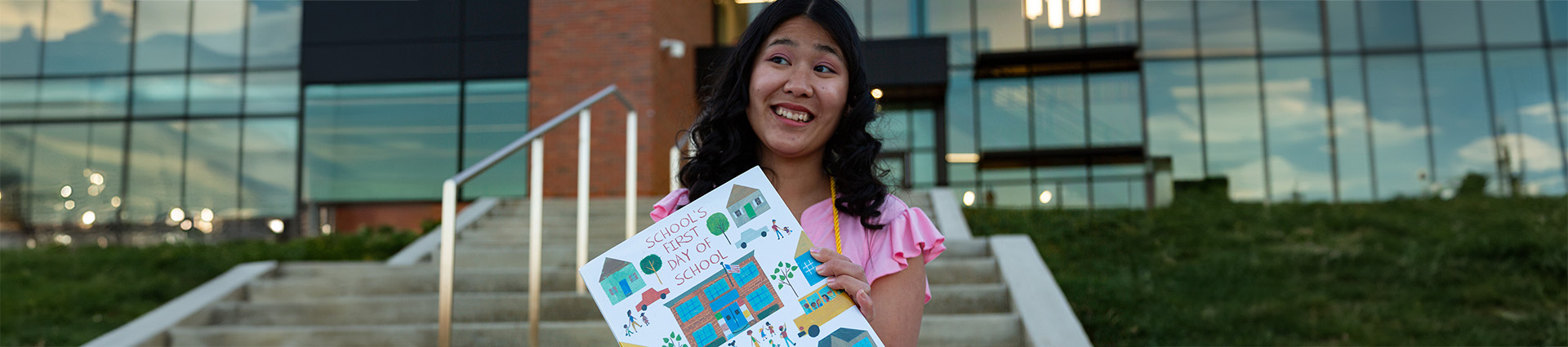Luckaupt holding a children's book.