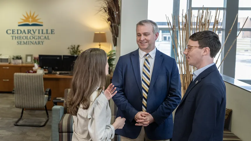 Dr. Billy Marsh talks with students.