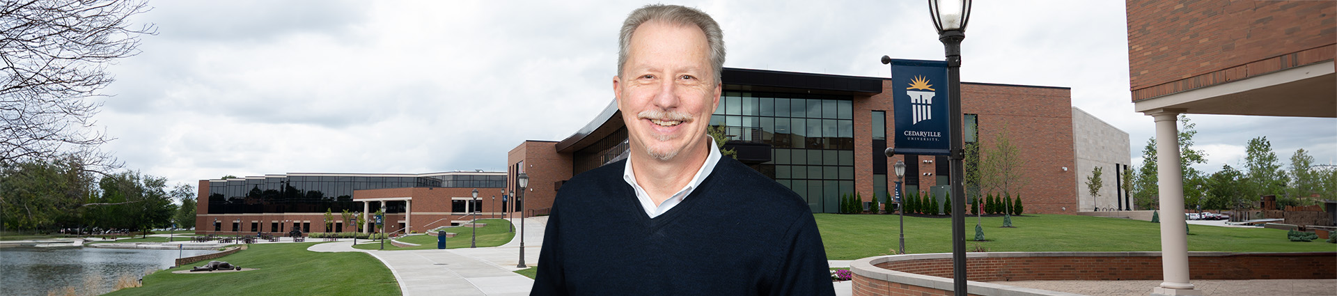 Chris Sohn standing in front of the Scharnberg Business and Communication Center.