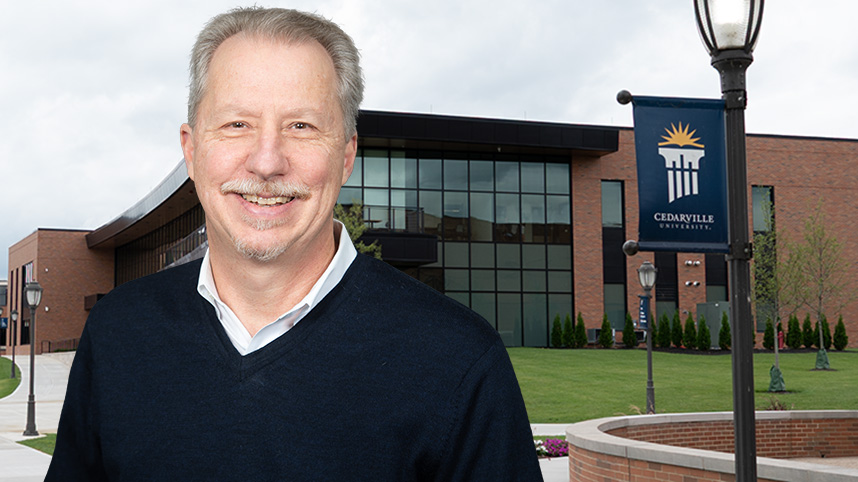 Chris Sohn standing in front of the Scharnberg Business and Communication Center.