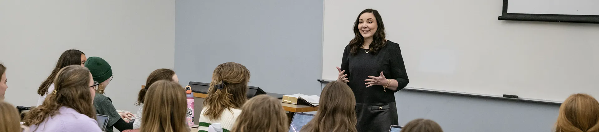 Female professor instructs women for service in the church.