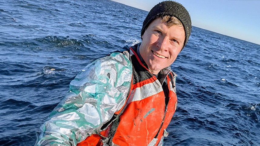 Toby Dewhurst with the ocean in the background.