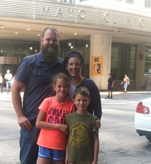 Taylor DeYoung and her family outside the Mayo Clinic during her mother's time of treatment.