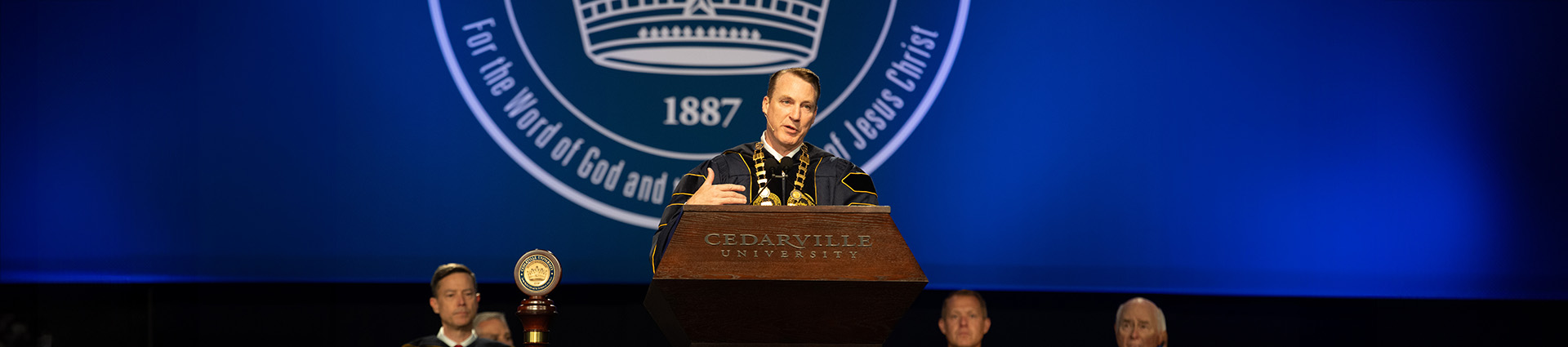 Dr. Thomas White speaking at commencement.