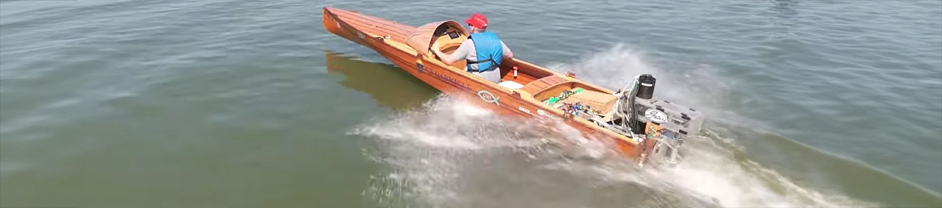 Cedarville's electric boat speeding across the water.