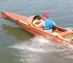 Winning boat speeding across the water.