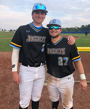 Tanner Gillis and Payton Eeles pose for a photo in their Cedarville baseball uniforms.