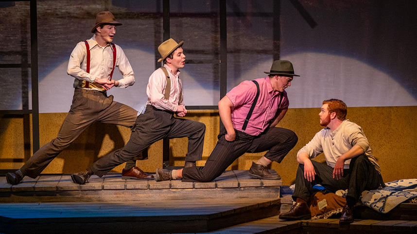 Actors dressed at 1940s era farmers sing during "Horizons of Gold."
