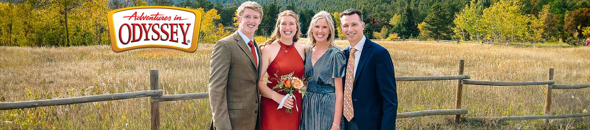 Rudy Haerr, his wife and adult children pose for a fall family photo with the Rocky Mountains in the background.