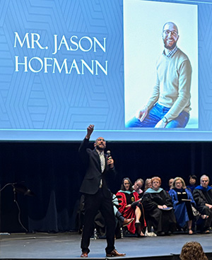 Jason Hofmann addressing Cedarville University education graduates.