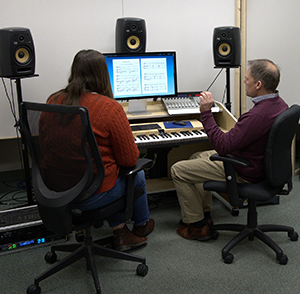 Professor Jaquith teaches a student in his newly remodeled music studio.