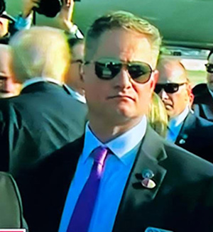 Jeff Rinehart with President Trump over his right shoulder.