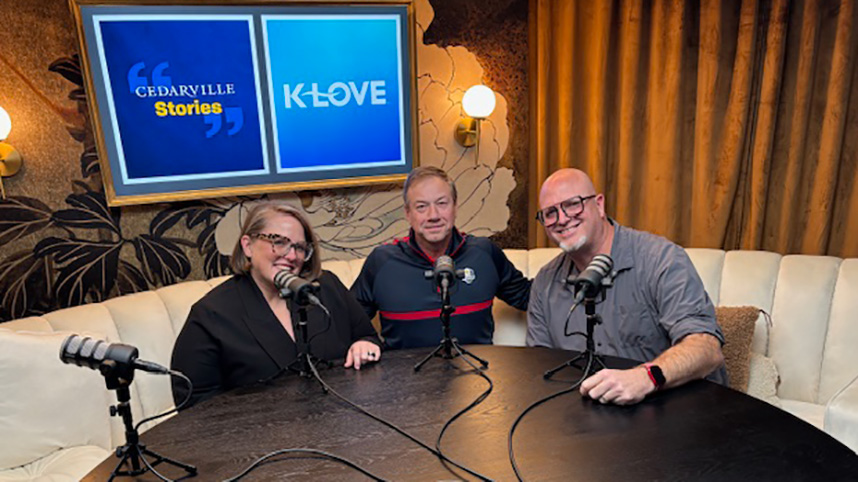 Mandy Young, Jim Houser, and Steve Shore sit around a table at K-Love studios in Franklin, Tennessee.