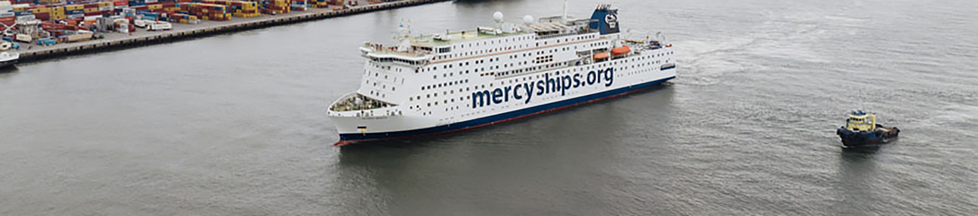A Mercy Ship sailing into port.