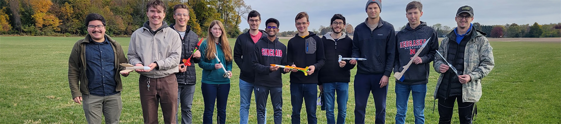 Cedarville University's NASA rocket launch team poses with small model rockets.