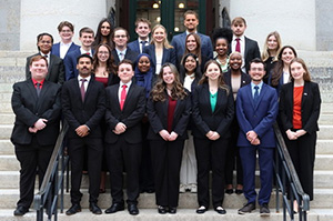 Rae Gill and approximately 20 other college student interns pose for a photo on the steps of the Ohio Statehouse.