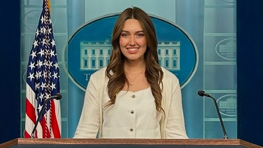 Paige Johnson stands at the podium in the White House press briefing room.