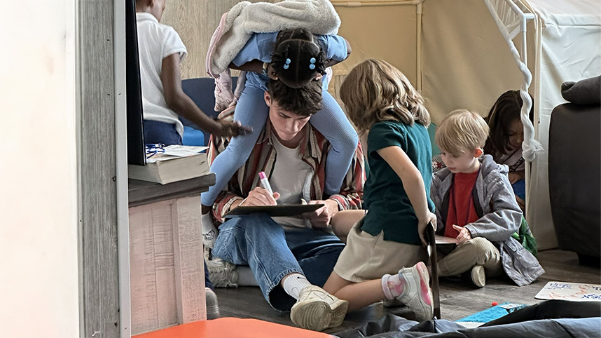 A Cedarville student enjoys playing with the elementary-aged students at the Ark of H.O.P.E.