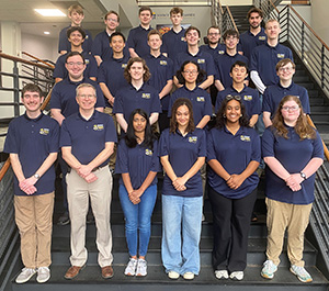 Members of the Cedarville University robotics team pose for a photo on the steps in the engineering building.
