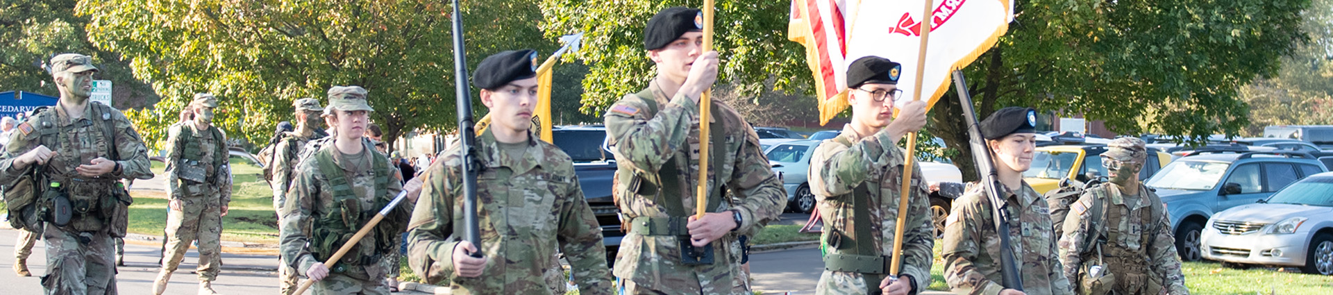 Uniformed Cedarville ROTC students march in the Homecoming parade.