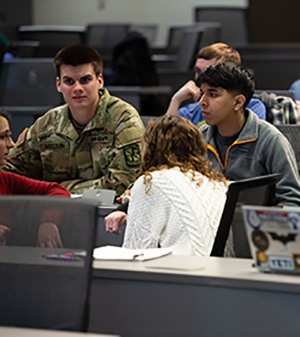 Uniformed ROTC students sits in class with other Cedarville students.