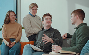 Four students discuss the Bible.