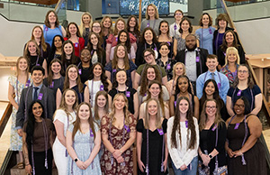 37 Cedarville University nursing students who were inducted into Sigma Theta Tau stand on the steps in the Stevens Student Center.