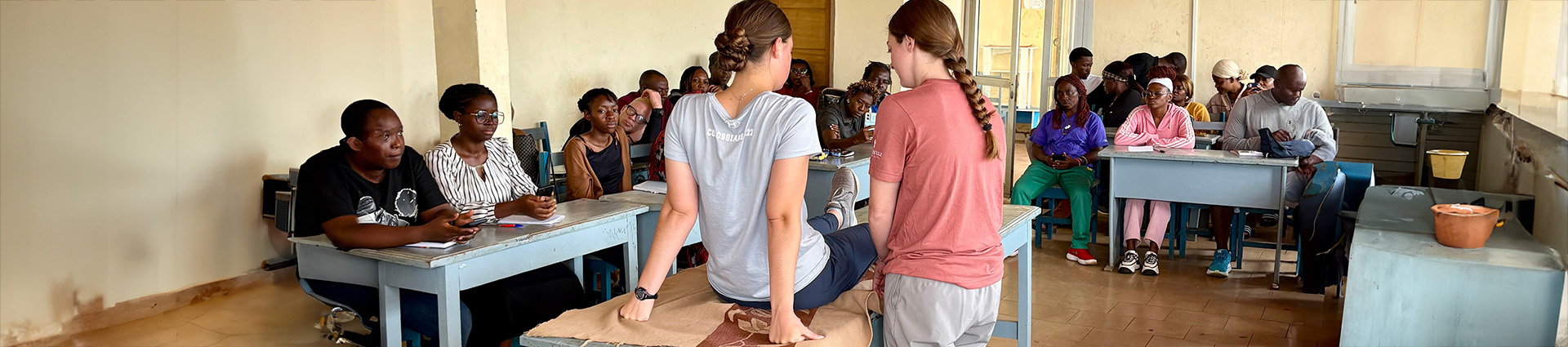 Two female Cedarville University athletic training graduates conduct a training in Cameroon.