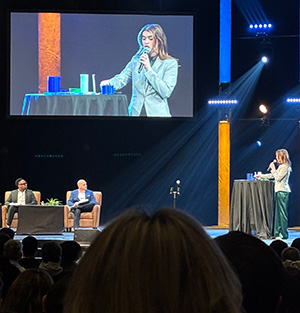 Jenna Stout on a big screen during her Pitch presentation.