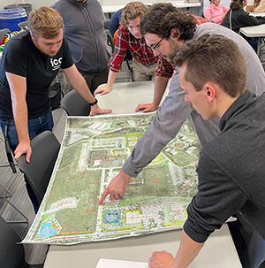 Students looking at a map of Broadview Villiage.