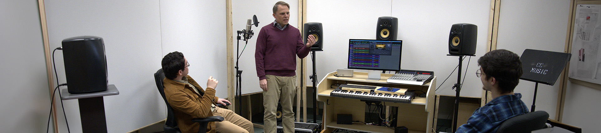 Professor Jaquith teaches two students in his newly remodeled music studio.